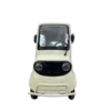 Front view of beige electric tricycle with enclosed body and round headlight design