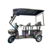 Gray electric passenger tricycle with canopy roof and transport seating layout