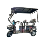 Gray electric passenger tricycle with canopy roof and transport seating layout