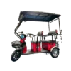 Red electric passenger tricycle with extended canopy and multi-seat passenger layout
