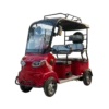 Red electric passenger tricycle with front cabin enclosure and roof for comfortable transport