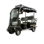 Black solar electric passenger tricycle with enclosed cabin and solar roof panel