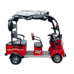 Side view of red electric passenger tricycle with open frame and roof structure