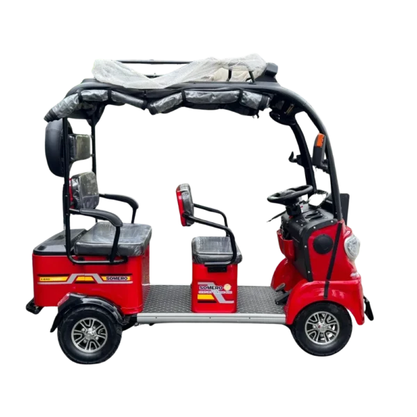 Side view of red electric passenger tricycle with open frame and roof structure