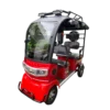 Red electric passenger tricycle with enclosed cabin and passenger seating