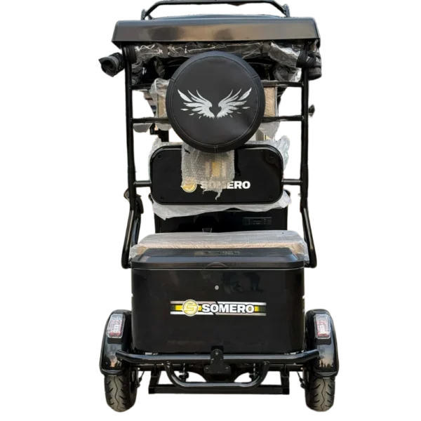 Rear view of electric passenger tricycle with mounted spare wheel and back storage area