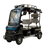 Front angled view of electric tricycle with windshield and enclosed cabin design