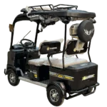 Rear angled view of electric passenger tricycle with spare tire and cargo compartment