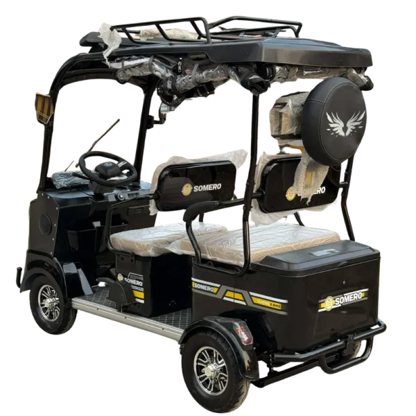 Rear angled view of electric passenger tricycle with spare tire and cargo compartment