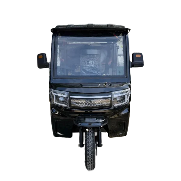 Front view of electric tricycle with windshield and compact urban design