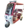Red electric passenger tricycle with roof and multi-passenger seating for transport