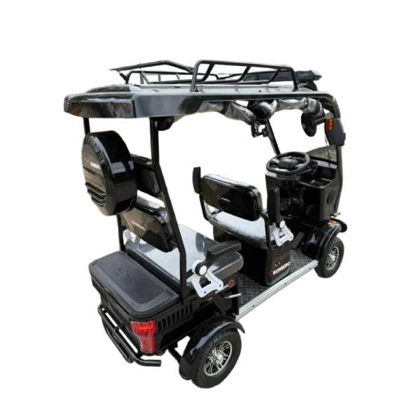 Rear angled view of black electric passenger tricycle showing seating area and roof structure