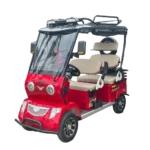 Red electric passenger tricycle with enclosed front cabin and roof for weather protection