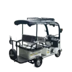 Angled rear view of white solar electric tricycle with cargo rack and solar roof