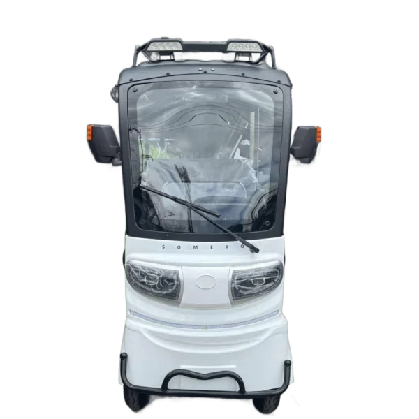 Front view of white solar electric passenger tricycle with windshield and roof panel system