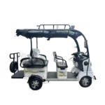 Left side view of solar powered electric tricycle with open frame and passenger seats