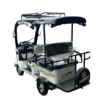Angled rear view of white solar electric tricycle with cargo rack and solar roof