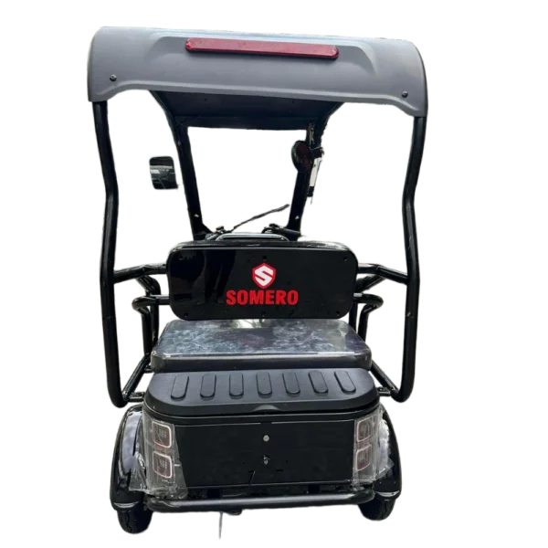 Rear view of electric passenger tricycle with roof showing passenger seating and back design