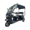 Angled view of electric passenger tricycle with roof and rear seating for transport