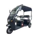 Angled view of electric passenger tricycle with roof and rear seating for transport